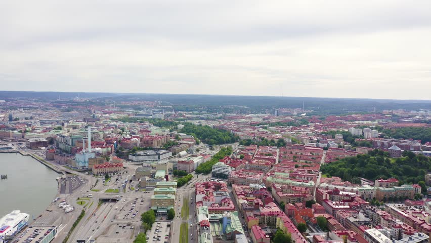 Inscription on video. Gothenburg, Sweden. Panorama of the city and the river Goeta Elv. The historical center of the city. Cloudy weather. Glitch effect text, Aerial View