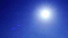Sunny clear deep blue sky background n bright sun light ray beam or bokeh sunlight lens flare with no cloud in tropical summer daylight sunshine day weather, slow or stop motion 4k b-roll TimeLapse - Powered by Shutterstock - Get 15% off with code: PIKWIZARD15