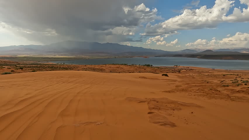 Sandy Hollow Lake Utah red sand dunes off road recreation POV. Red rocks and sand, dry arid landscape. Rocky terrain and sand dunes. Fun and adventure riding in central Utah. sometimes dangerous.