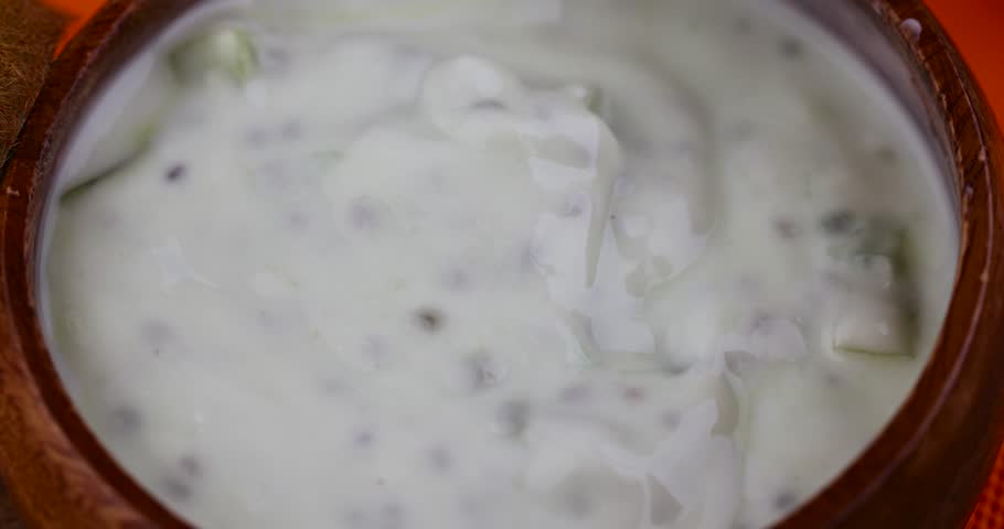 Milk fresh yogurt with kiwi flavor and kiwi slices, fresh yogurt made from natural ingredients with kiwi | Shutterstock HD Video #1104324157
