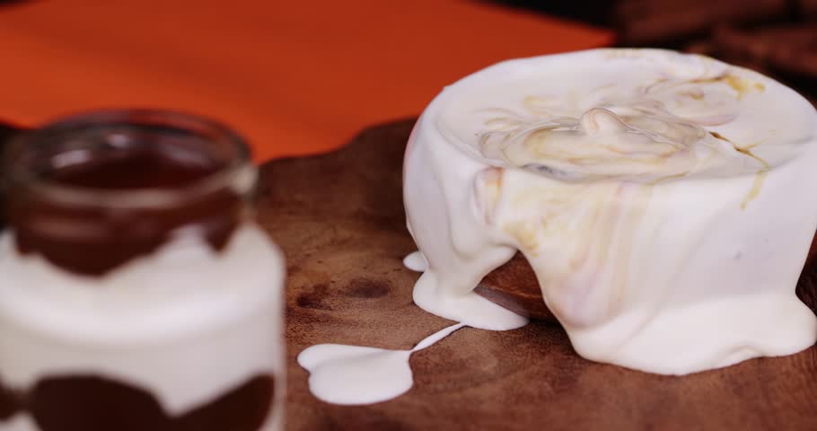 Milk sweet yogurt with bifidobacteria and chocolate addition, delicious sweet chocolate taste of fresh yogurt | Shutterstock HD Video #1104324181