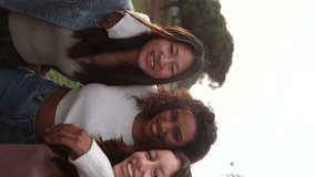 vertical video for social media of female friends posing happy, group of diverse women making selfie outdoors, - Powered by Shutterstock - Get 15% off with code: PIKWIZARD15
