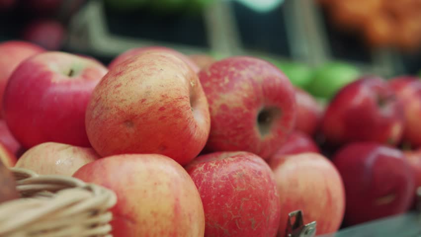 Apples lying on the shelf in the supermarket. Close up. Royalty-Free Stock Footage #1104327553