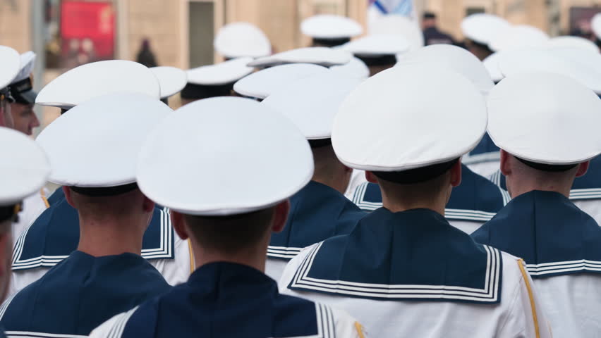 Lot young sailors man marching. Naval military forces. 9 may war victory parade. Marine troop army. Navy soldier stepping close up. Blue sea suit uniform. Sailor cadets walk slow motion. Kid seal team Royalty-Free Stock Footage #1104328035