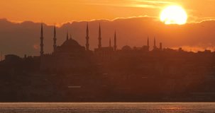 4K Video of Istanbul Landscape at Warm Sunset with Blue Mosque (Sultanahmet Camii), sun, clouds and seascape