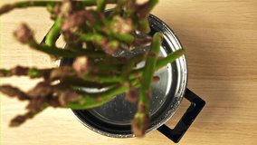 The asparagus falls into the pot. Filmed is slow motion 1000 fps. High quality FullHD footage - Powered by Shutterstock - Get 15% off with code: PIKWIZARD15