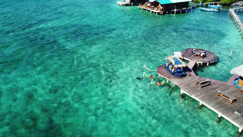 Drone Overwater Bungalow in the beautiful tropical waters of Bocas Del Toro, Panama Royalty-Free Stock Footage #1104334735