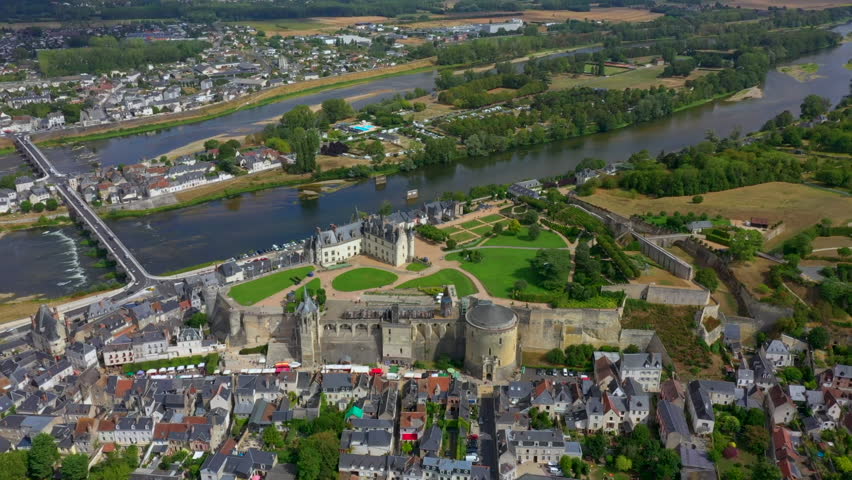 HD hight quality aerial footage spectacular view of Amboise castle in Amboise in France, Loire Valley luxurious mansion in summer day, green lawns and river. Beautiful French landscape
