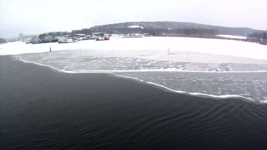 Sail away in icy Gulf of Finland - close to the entrance of Helsinki port - Landscape view of winter in Finland