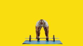 African man doing row exercise with bar and weights