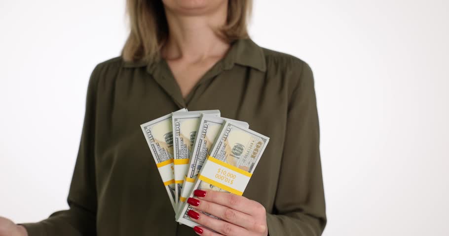 Woman with dollar bills and red umbrella on white background | Shutterstock HD Video #1104349991