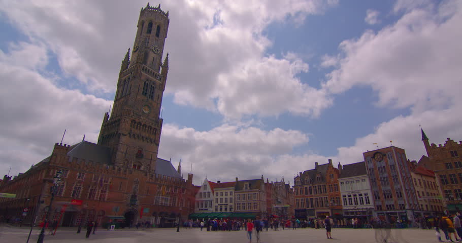 Time lapse in the popular Belgian city of Bruges. Establishing footage old houses. Wide sweeping shot of the city of Bruges. Famous the cities landscape and historic landmarks