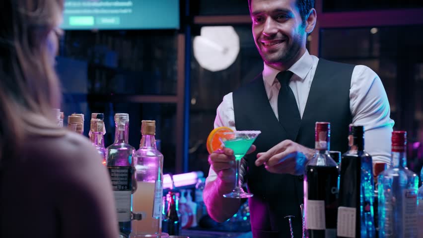 Professional bartender man talking and take order with clients at in modern bar in restaurant. Royalty-Free Stock Footage #1104354627