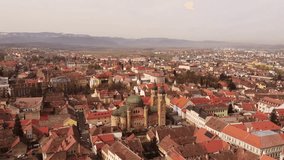 Sweeping over Sibiu, this video captures the vibrant mix of Gothic and Baroque architecture. Red rooftops dot the landscape, interspersed with verdant parks and cobbled squares.