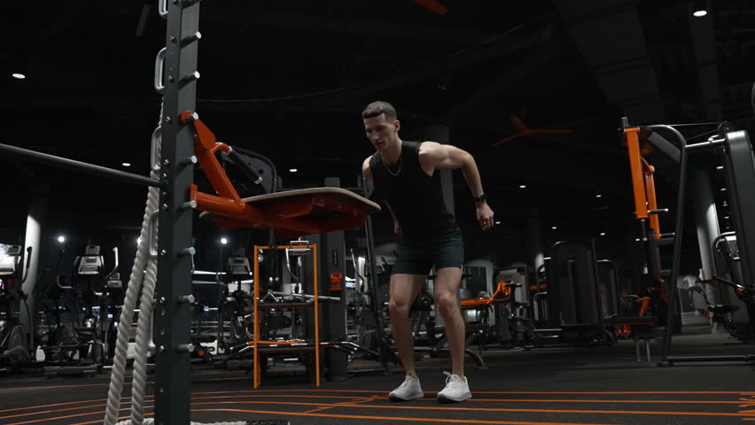 athlete man jump in sport gym. athlete man training jump in fitness gym. fitness and sport. Royalty-Free Stock Footage #1104361919
