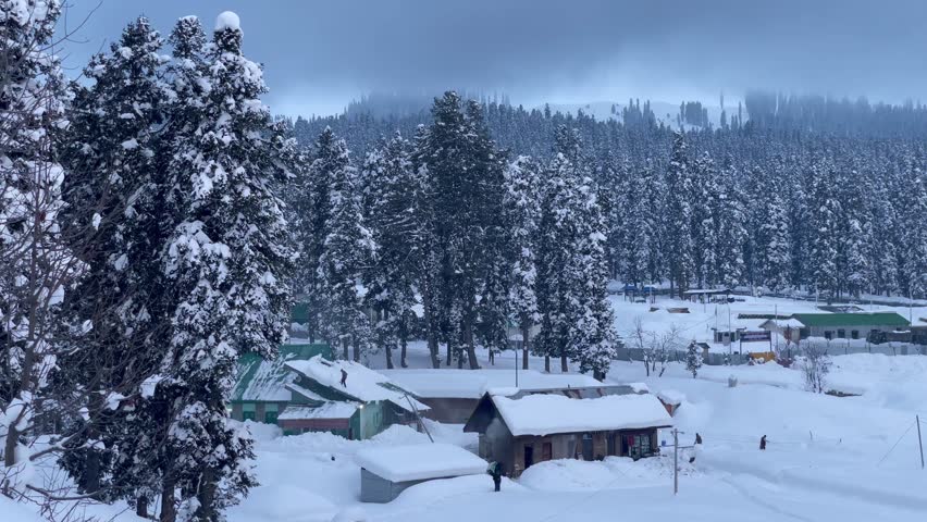 Gulmarg Ski Resort In Deep Snow During Winter In Kashmir, India. Panning Shot Royalty-Free Stock Footage #1104363697