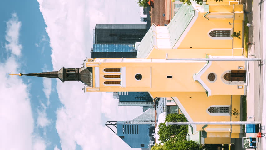 Tallinn, Estonia. Church Of St. John Jaani Kirik At Sunny Summer Day. Vertical Footage Video Large Lutheran Parish Church In Tallinn Dedicated To St. John The Evangelist, Disciple Of Jesus Christ.