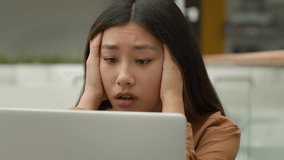 Exhausted overworked Asian woman girl student studying online work on laptop in office hold head headache tired chinese korean female employee businesswoman upset job failure despair fatigue burnout - Powered by Shutterstock - Get 15% off with code: PIKWIZARD15