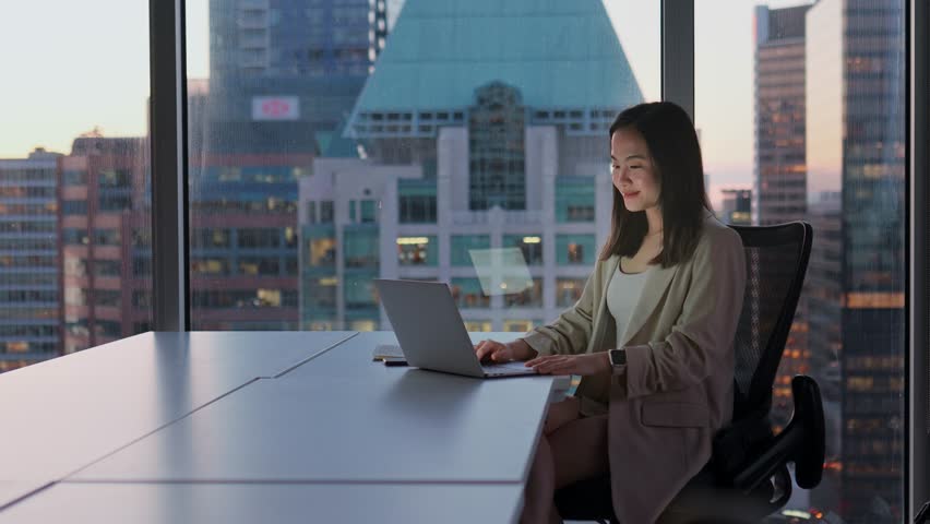 Young happy Asian woman executive leader or hr manager having remote video conference call meeting communicating by videocall on job interview working on laptop in modern office. Royalty-Free Stock Footage #1104365229