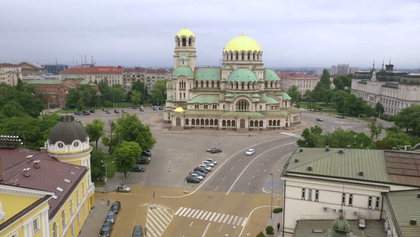 4K Aerial view of capital of Bulgaria, Sofia. Iconic building of the world-famous Sofia. View to cathedral St. Alexander Nevsky, the largest church in the Balkans. Roofs of buildings, streets and park
