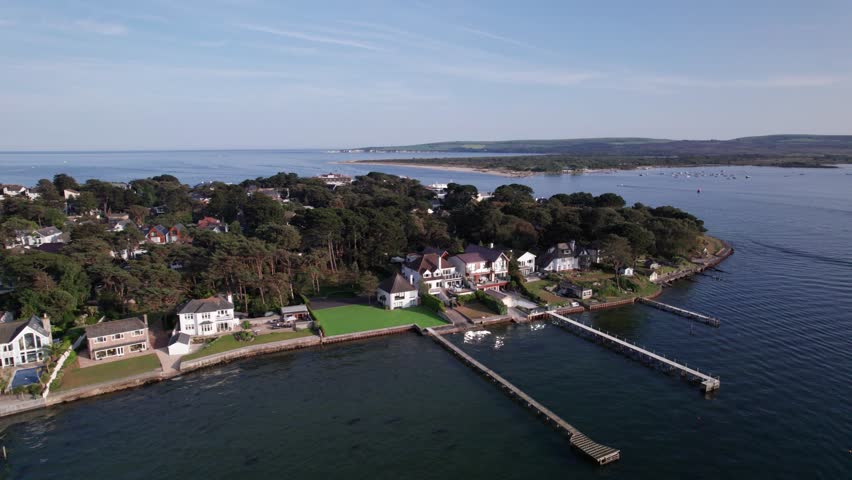 Sandbanks is an affluent neighbourhood of Poole, Dorset, on the south coast of England, situated on a narrow spit of around 1 km² or 0.39 sq mi extending into the mouth of Poole Harbour. 