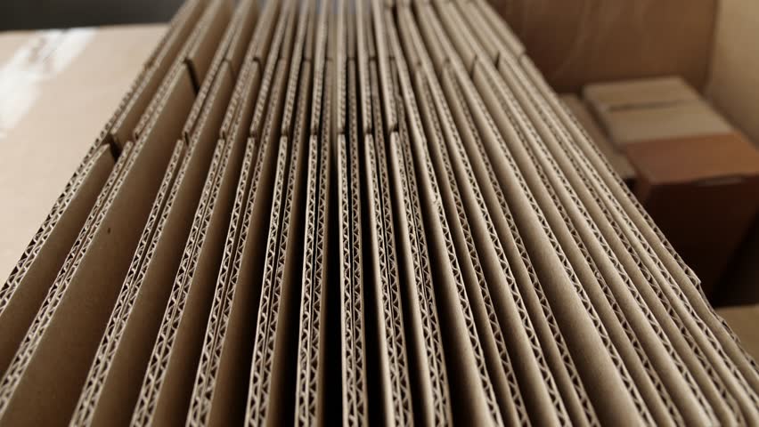 Cardboard boxes for packaging moving and shipping. Corrugated cardboard. Paper production. Industry. Manufacturing of packaging Royalty-Free Stock Footage #1104367551