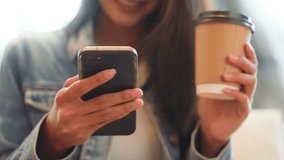 Young asian beautiful woman using smart phone in coffee shop cafe, typing write message on mobile, online shopping, transfer payment, internet banking - Powered by Shutterstock - Get 15% off with code: PIKWIZARD15