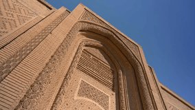 Facade of Abbasid palace, Baghdad in Iraq. Low angle with blue sky in background