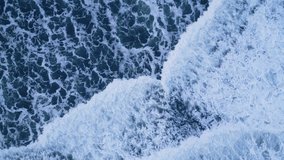 Vertical video: Drone shot of nordic ocean coastline with black sand beaches, icelandic natural scenery. Majestic atlantic shore landscape in iceland with snowy mountains and freezing cold water. 60 - Powered by Shutterstock - Get 15% off with code: PIKWIZARD15