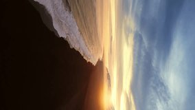 Vertical video: Icelandic black sand beach aerial view, spectacular atlantic shore with waves crashing on coastline. Arctic scenery with snowy mountains and black sand on beaches, cold landscape. 60 - Powered by Shutterstock - Get 15% off with code: PIKWIZARD15