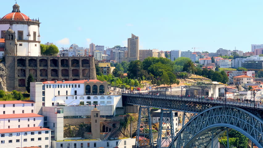 Porto, Portugal. Luis i Bridge spanning the canal from the old city, along the famous promenade of the Douro River. Beautiful medieval Unesco world heritage city. High-quality 4k footage