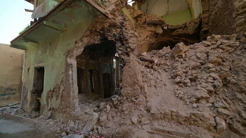 Houses and buildings destroyed during shelling in Mosul, Iraq. Low angle