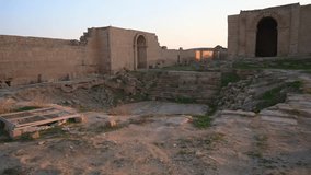 Building ruins of Hatra with doorway in background, Iraq. First-person view