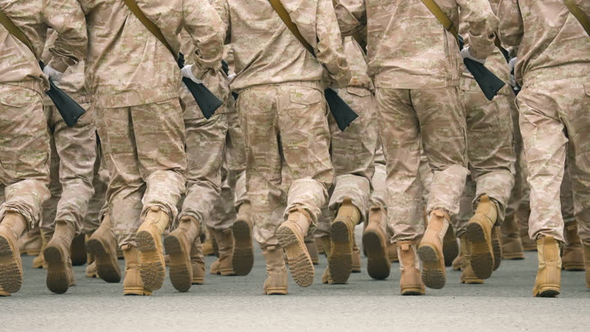 Military boots close up. Lot armed soldier walk slow motion. Male war team. Army platoon step. Many officers march. Men combat troop. Hot spot fight. Nation military forces. Sand desert shoe uniform. | Shutterstock HD Video #1104385201