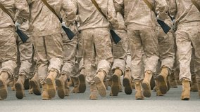 Military boots close up. Lot armed soldier walk slow motion. Male war team. Army platoon step. Many officers march. Men combat troop. Hot spot fight. Nation military forces. Sand desert shoe uniform. - Powered by Shutterstock - Get 15% off with code: PIKWIZARD15