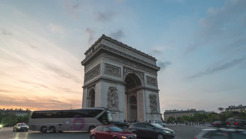 Paris France time lapse 4K, city skyline day to night sunset timelapse at Arc de Triomphe and Champs Elysees street Royalty-Free Stock Footage #1104394951
