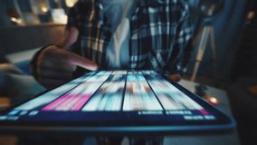 Close-up shot of unrecognizable girl in casual outfit choosing movie to watch in evening and using streaming platform. Footage of female hands touching screen, scrolling through application - Powered by Shutterstock - Get 15% off with code: PIKWIZARD15