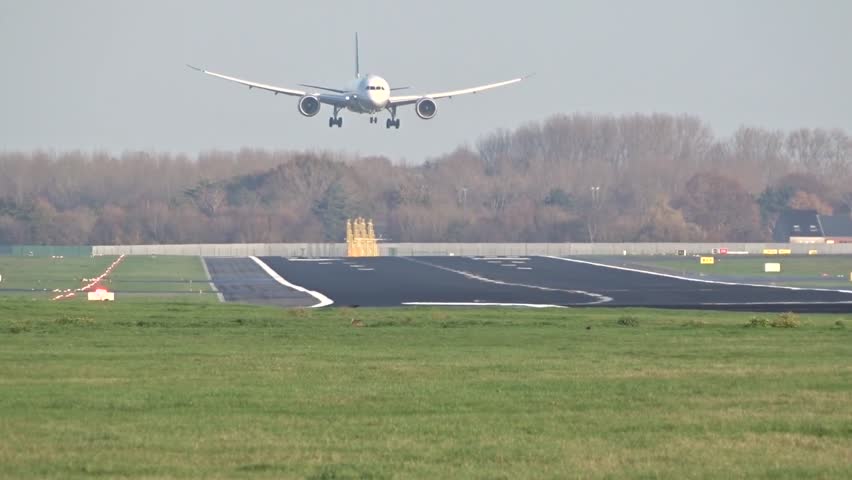 Big Airplane Aircraft Landing with Touchdown at International Airport Generic Unmarked and White