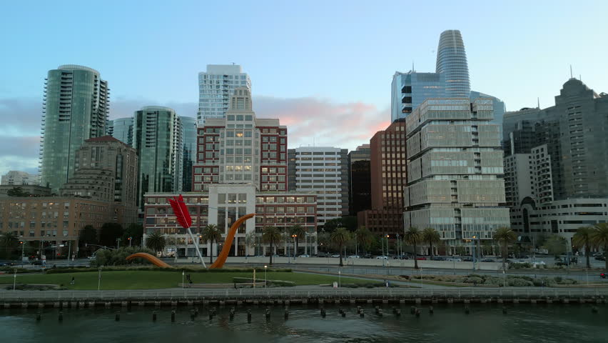 Breathtaking Sunset aerial video over there bay area, Embarcadero and San Francisco skyline with blue and purple sky on the background. California. High-quality 4K footage