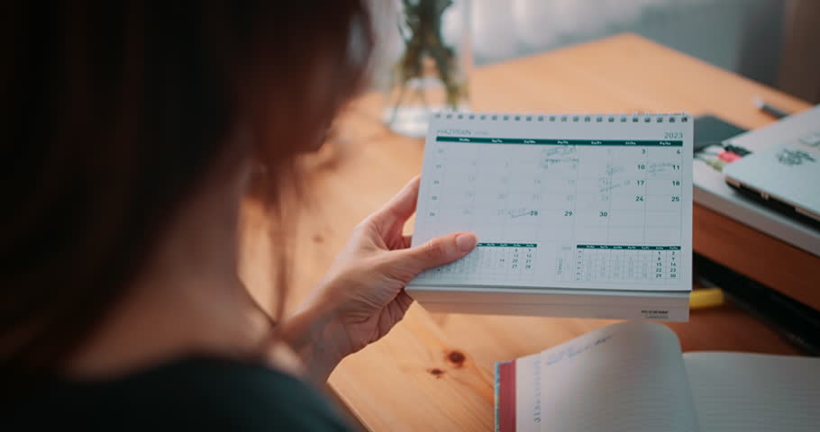 Female marking date on calendar, business calendar for event planning Royalty-Free Stock Footage #1104409677