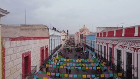 drone pan 4k video of a mexican city hispanic festival heritage travel in america puebla colorful downtown facade aerial view mexico trip