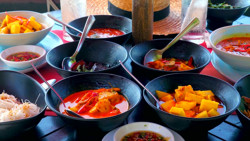 Flavors of Thailand with a variety of traditional dishes in a sea restaurant. Enjoy fresh seafood, spicy curries. Rich culinary culture of Asia on vacation.