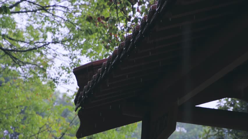 Rain falling from the eaves of ancient buildings | Shutterstock HD Video #1104425949