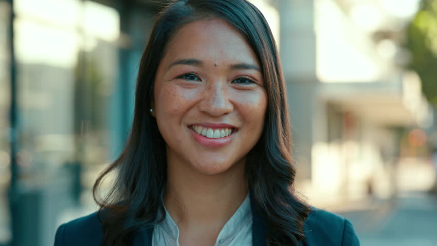 Happy, smile and face of a businesswoman in the city with a positive, good and confident mindset. Success, happiness and portrait of a professional female employee standing with confidence in town. | Shutterstock HD Video #1104426191