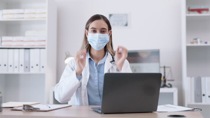 Removing mask, doctor face and a woman in an office for healthcare, consulting and support. Happy, covid and portrait of a female gp at a desk for pandemic end, smiling and at a hospital for work | Shutterstock HD Video #1104426229