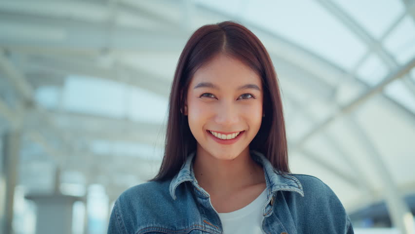 Close-up portrait of happy asian woman look at camera with perfect teeth smile in city summer, positive | Shutterstock HD Video #1104430021