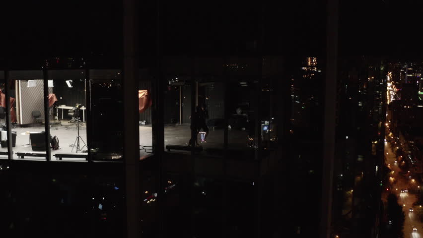 Boxers in skyscraper. Stock footage. Top view of people in apartments of skyscraper at night. Boxers are engaged on high floor of high-rise | Shutterstock HD Video #1104433133