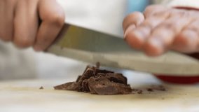 cuttingchopping chocolate, horizontal raw footage