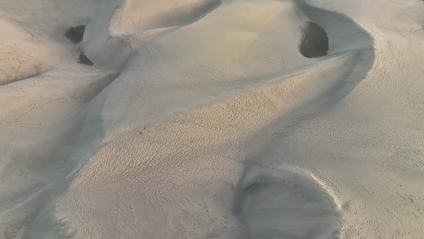 Aerial video of sunrise golden hour at the Dunas the Maspalomas park on the canary island of Gran Canaria, Spain