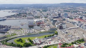 Inscription on video. Oslo, Norway. City center from the air. Embankment Oslo Fjord. Multicolored text appears and disappears, Aerial View